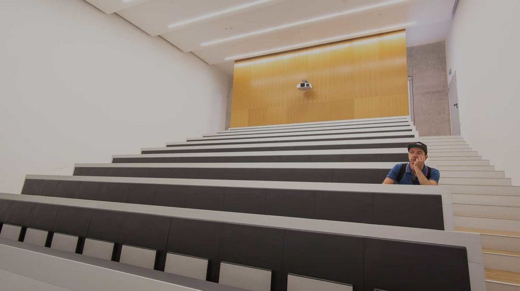 student alone in lecture theatre