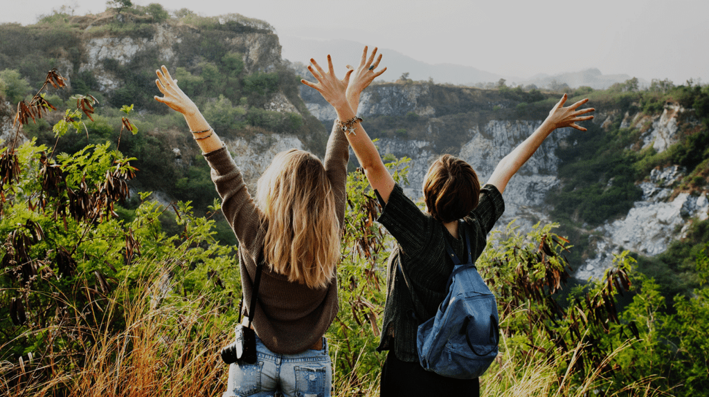 girls celebrating on mountain