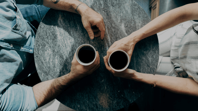 men drinking coffee in meeting