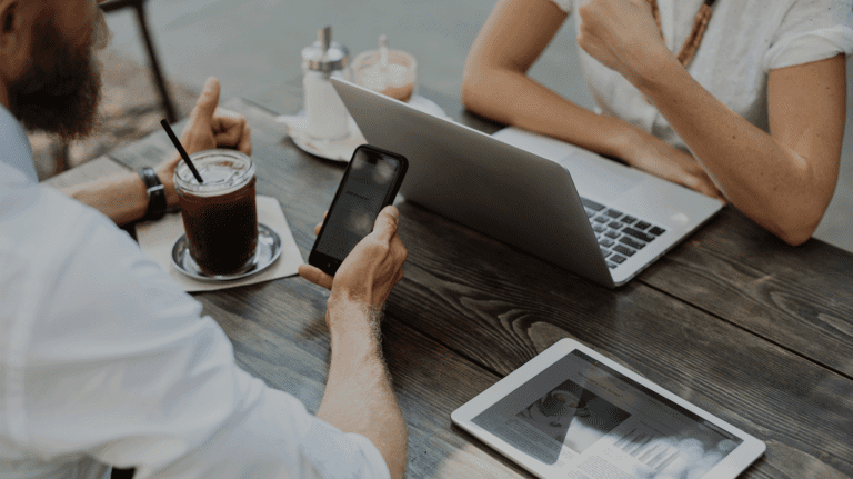 man on mobile phone in casual meeting