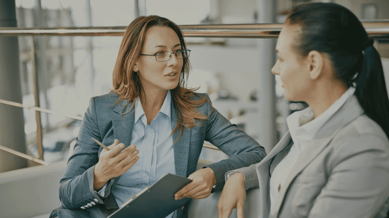 two office workers in a meeting