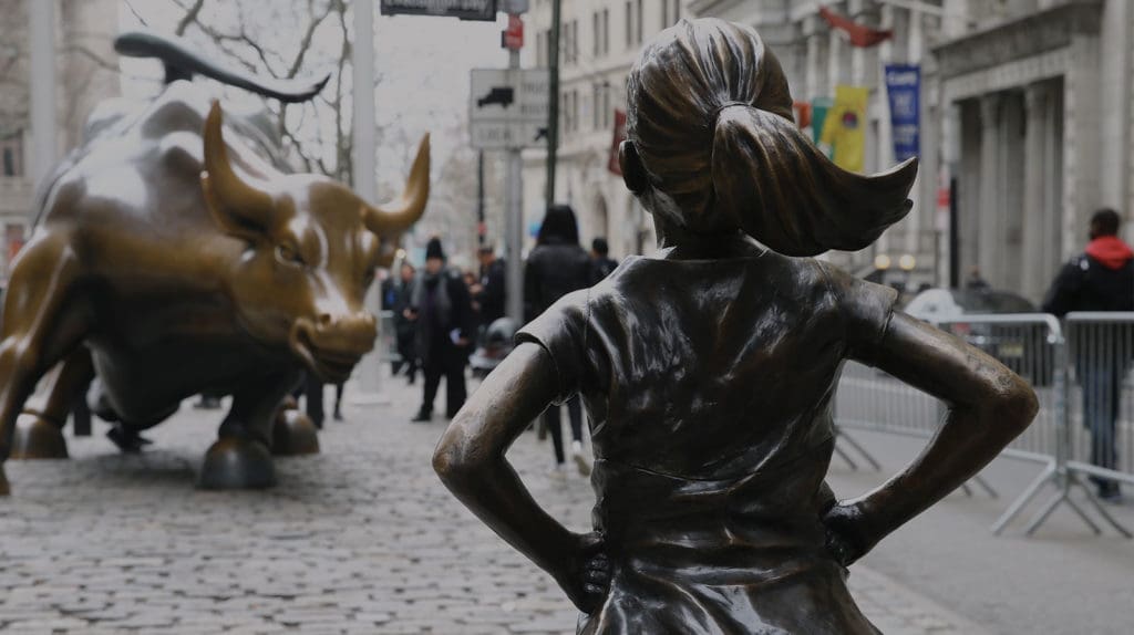 Girl standing in front of bull