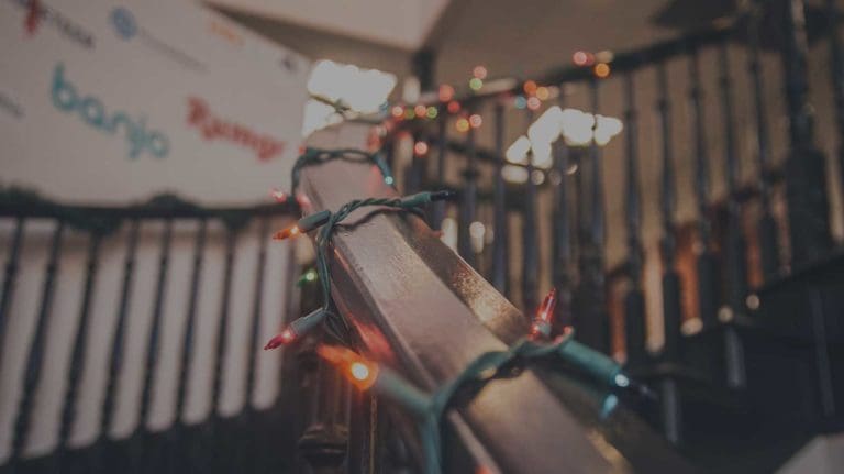 Seasonal lights wrapped around a staircase